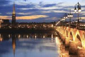 Pont de pierre bridge with St Michel cathedral, Bordeaux, France